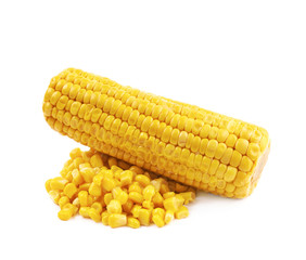 Corncob next to a pile of kernels