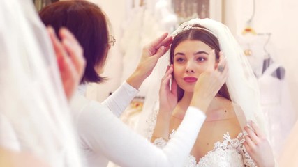 Saleswoman helping in the wedding salon