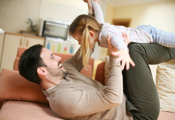 Father playing with his daughter.