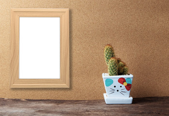 blank wooden frame mockup with basket of chamomile flowers