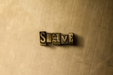 SLAVE - close-up of grungy vintage typeset word on metal backdrop. Royalty free stock illustration.  Can be used for online banner ads and direct mail.