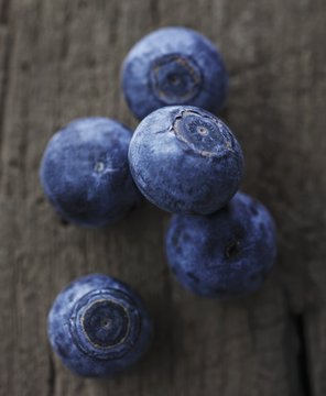 Blueberries on a wooden surface
