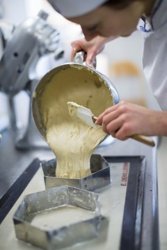 Lebkuchenteig being transferred to baking tins
