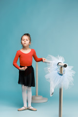 The little balerina dancer on blue background © master1305