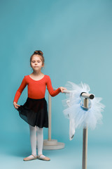 The little balerina dancer on blue background © master1305