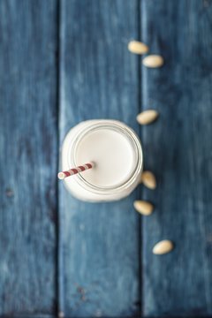 Almond milk in glasses with straws