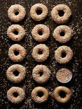 Caramel doughnuts with colorful sugar sprinkles