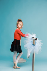 The little balerina dancer on blue background © master1305