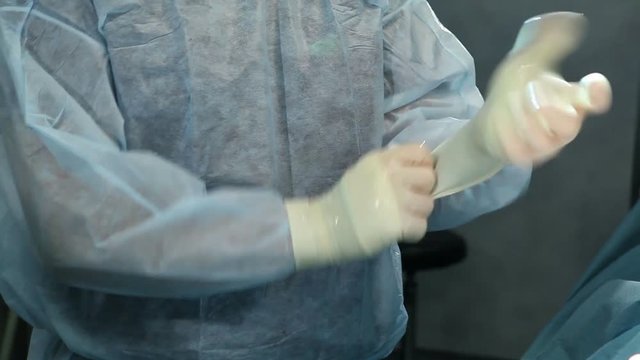 Surgeon scrubbing hands in gloves. Sugeon in operating room