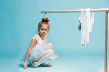 The little balerina dancer on blue background © master1305