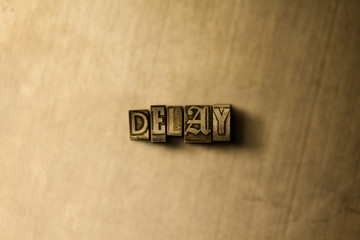 DELAY - close-up of grungy vintage typeset word on metal backdrop. Royalty free stock illustration.  Can be used for online banner ads and direct mail.