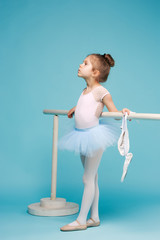 The little balerina dancer on blue background © master1305