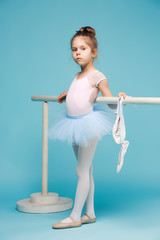 The little balerina dancer on blue background © master1305