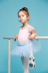 The little balerina dancer on blue background © master1305