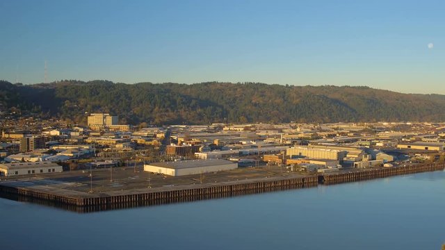 Portland Aerial v65 Flying low over train yard area panning with westside views at sunrise.