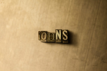 JOHNS - close-up of grungy vintage typeset word on metal backdrop. Royalty free stock illustration.  Can be used for online banner ads and direct mail.