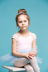 The little balerina dancer on blue background © master1305