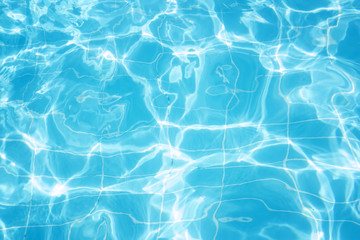 Vibrant in the sun waters in the pool blue background