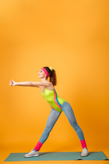 Fototapeta na wymiar Amazing young sports lady make sports exercises