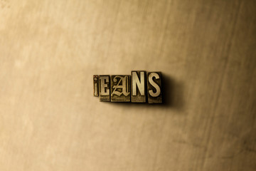 JEANS - close-up of grungy vintage typeset word on metal backdrop. Royalty free stock illustration.  Can be used for online banner ads and direct mail.