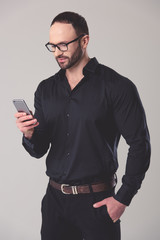 Handsome businessman with gadget