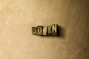 DOZEN - close-up of grungy vintage typeset word on metal backdrop. Royalty free stock illustration.  Can be used for online banner ads and direct mail.