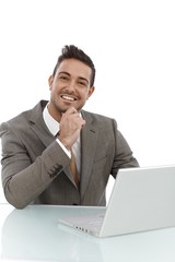 Portrait of happy young businessman