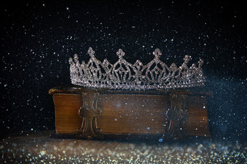 low key of diamond queen crown on old book © tomertu