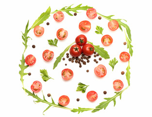fresh vegetable, allspice, cherry tomato and arugula isolated on white