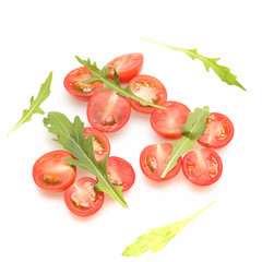 fresh vegetable, cherry tomato and green arugula isolated on white