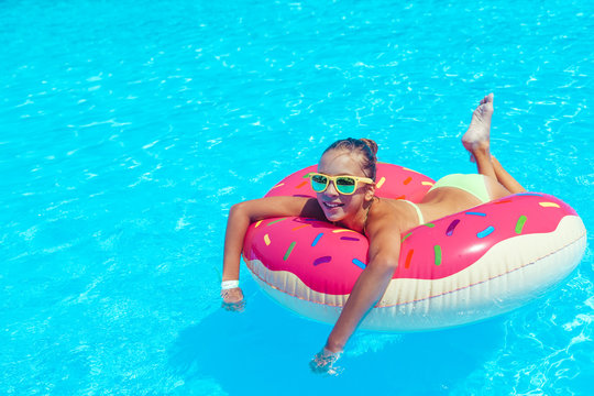 Tween girl in resort pool