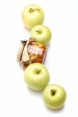 fresh green apple fruit with honey jar of nuts
