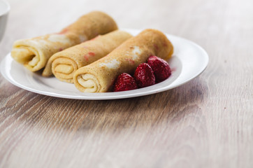 Pancakes with strawberry on a plate