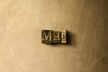 MAC - close-up of grungy vintage typeset word on metal backdrop. Royalty free stock illustration.  Can be used for online banner ads and direct mail.