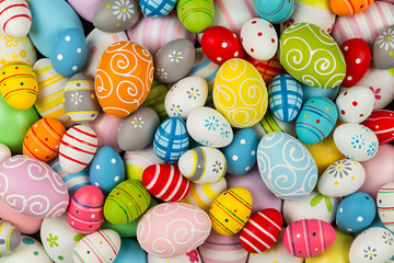 easter background with many colorful painted decorated eggs