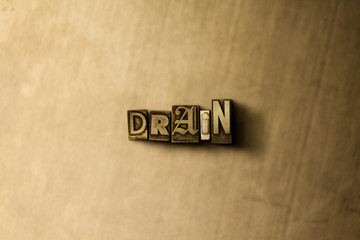 DRAIN - close-up of grungy vintage typeset word on metal backdrop. Royalty free stock illustration.  Can be used for online banner ads and direct mail.
