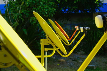 Satellite dishes on lawn.