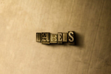 LABELS - close-up of grungy vintage typeset word on metal backdrop. Royalty free stock illustration.  Can be used for online banner ads and direct mail.