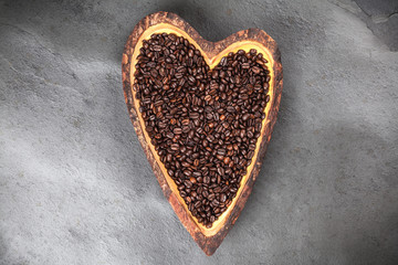 Coffee beans in a heart shaped bowl