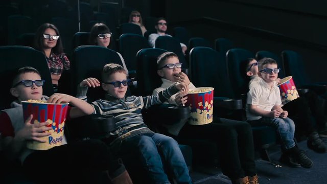 Children are watching 3D movie in the cinema