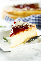 Cheesecake with berry sauce and almond