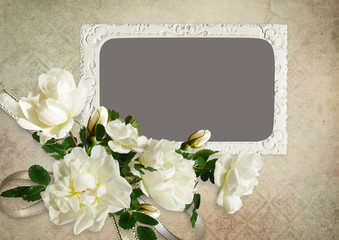 The frame and white roses on a vintage background