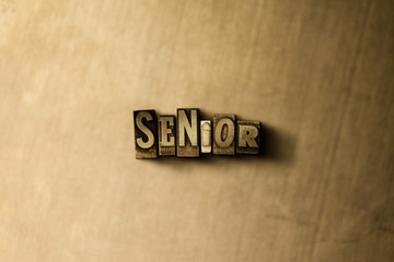SENIOR - close-up of grungy vintage typeset word on metal backdrop. Royalty free stock illustration.  Can be used for online banner ads and direct mail.