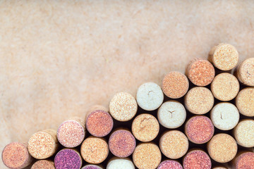 Wine corks background. Used wine corks arranged diagonally on blurred light background. Registration page for the wine list. The background for the restaurant menu.