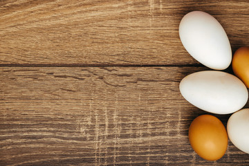 chicken eggs on wooden background