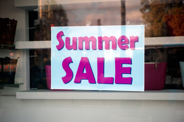 Signboard Summer sale in shop window