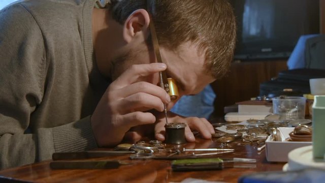watchmaker clockwork repairs in the workshop