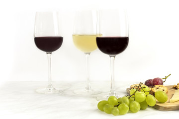 Red and white wine with bread and grapes