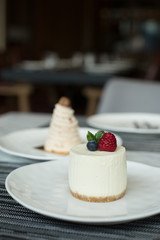 Plates of Cheesecake and Mont Blanc on Table in Restaurant
