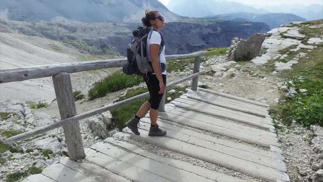 Trekking in beautiful Italian Alps - Dolomites. Famous Tre Cime rock formation. Dolomites National Park, Italy.